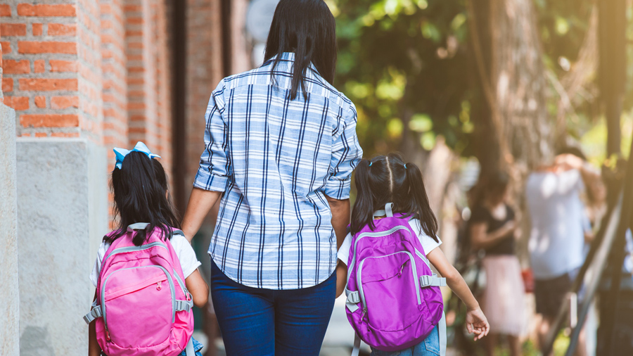 community-people-protection-Mother-walking-kids-to-school-1